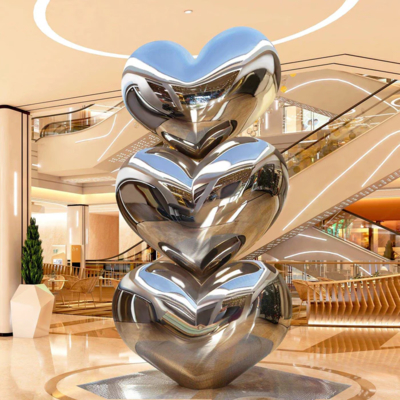 Un bon prix. Décoration d'hôtel Finition miroir cœur empilé sculpture en acier inoxydable en ligne